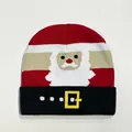 Macro detail of Christmas knit beanie with striped pattern and Santa Claus graphic - Style 1 (Red White Beige Santa)