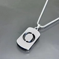 Detail of silver titanium steel necklace featuring a rectangular hollow tag pendant - Letter O
