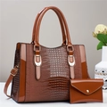 Brown crocodile pattern faux leather handbag set with matching purse in studio lighting - Khaki/Earth Yellow