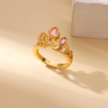 Macro view of golden crown ring featuring pink teardrop and red round zircon stones - Adjustable Open / Gold Crown Red Pink Gem Style (G4127635)