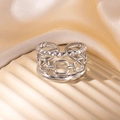 Detail of silver multi-layer open ring featuring chain and textured band on display - Steel Color 87