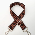 Detail of adjustable geometric patterned fabric shoulder strap with gold metal lobster clasps - Coffee