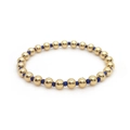Minimalist 18K gold-plated beaded bracelet with blue accent beads on white background - Gold + Ink Blue