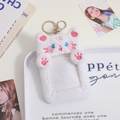 Detail of white plush cat-shaped photo card holder with embroidery and metal keychain - White Cat