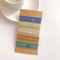 Close-up of five sets of high-elastic hair ties in various textures on craft paper cards - 20 Thread Sets (about 38g Per Card)