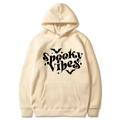 Cream Halloween hoodie with Spooky Vibes text and bat print on white background - Khaki