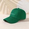 Detailed embroidery of white cursive Freedom text on dark green cotton baseball cap - One Size / Olive Green