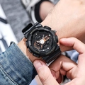 Detail of black sports digital watch with rubber strap and WR30BAR shockproof features - Black Gold