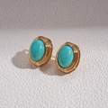 Close-up of retro gold-tone earrings with oval turquoise stones and hammered metal texture - Stud Earrings - Blue (WE3991)