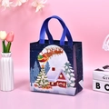 Blue Christmas non-woven gift bag featuring Santa and reindeer pattern for holiday shopping - Dark Blue Snow Scene