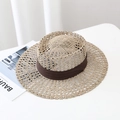 Close-up of woven seagrass sun hat with breathable cutout pattern and brown ribbon - M (56-58cm) / Coffee