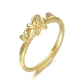 Detail of adjustable gold flower ring featuring delicate petals and a tiny pink gemstone - September