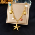Detail of 18K gold-plated starfish and shell necklace with pearls and beads on gift box - Starfish Shell Pearl Style (N3500)