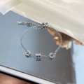 Silver stainless steel bracelet with engraved Roman numeral rings and spiral charm - Silver