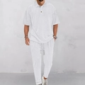 Detail view of men's white knit polo and drawstring pants set with waffle texture - S / White