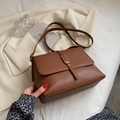 Retro brown leather shoulder bag with gold metal buckle for a stylish urban look - Brown