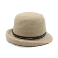 Close-up of beige knitted sun hat featuring a black ribbon with metallic gold studs - M(56-58cm) / Beige