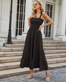 Detail view of the black sleeveless tiered maxi dress with elegant ruffles on stairs - S / Solid Black