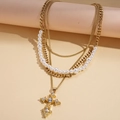 Collier multicouche doré élégant avec perles et pendentif croix serti de cristaux - Collier - Or