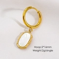 Detailed macro view of 16mm gold hoop earring with white oval natural stone pendant - White Shell Oval