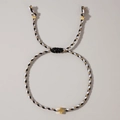 Handmade woven cross bracelet with black, white and gold cords and metallic cross - Black White Classic Cross