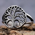 Polished silver Tree of Life stainless steel ring displayed on natural tree bark background - US 7 / Silver (18101)