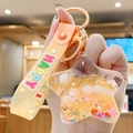 Star-shaped liquid quicksand keychain with orange bear, fruit slices and silicone strap - Fresh Star - Orange