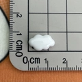 Macro shot of a mini white resin cloud charm with ruler showing 1.5cm width measurement - Pure White Cloud Small