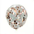 Detailed view of clear latex balloon filled with rose gold round metallic confetti dots - Rose Gold Sequin
