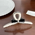 Elegant black and white acetate bow hair claw clip displayed on a wooden surface - White Base Bowknot Large-13cm