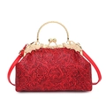 Red vintage shell bag with floral embossing, gold round handle, and pearl clasp - Red