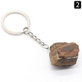Natural Tiger Eye stone keychain with irregular brown and yellow stripes on white background - Tiger's Eye