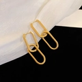Elegant gold metal U-shaped link earrings with a polished finish on textured background - Gold