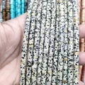 Macro shot of natural Dalmatian Jasper wheel beads for DIY jewelry making - Dalmatian Jasper