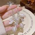 Elegant long floral earrings with white pearls and sparkling crystals in champagne gold - Flower Pearl Earhooks (E0221)