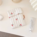 Detailed shot of cherry print quilted cotton makeup bag with a snap closure and soft texture - Sanitary Pouch (Vertical Quilted)