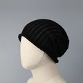 Close-up of black knit beanie featuring colorful confetti specks and vertical rib textures - One Size (57-62cm) / Black