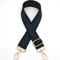 Detail of adjustable maze pattern bag strap with green weave and gold metal hooks - Peacock Green