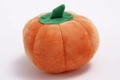 Pumpkin plush dog toy in bright orange with green felt leaves for interactive pet play - Pumpkin