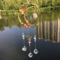 Moon dream catcher with green leaves, orange butterflies, and pink crystal stones - Rose Quartz
