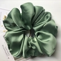 Oversized satin hair scrunchie in sage green finish with smooth glossy texture - Light Green