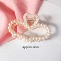 Pinza per capelli a cuore con perle