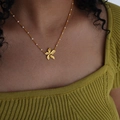 Golden petal pendant necklace with white beads and brushed 18k gold finish for women - Gold