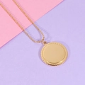 Macro detail of golden round pendant with twisted edge and polished center on bead chain - 18K Gold Plated (MP097)
