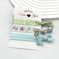 Detail of light blue and gold elastic hair ties with leopard print and sea star charms - Ocean Series - Starfish (8)