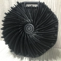 Ergonomic black silicone body scrubber with spiral bristles and easy-grip handle - Black