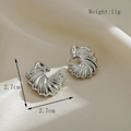 Vintage verzilverde oorbellen in schelpvorm met afmetingen en gewicht van 11g - Zilver