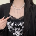 Elegant double-layered pearl necklace with silver metal fringe on a female model - Double Layer Artificial Pearl Silver Metal Tassel Necklace (X4789)