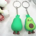 Cute pair of 3D cartoon avocado keychains with smiling faces and silver metal rings - Large Avocado