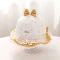 Close-up of baby sun hat featuring yellow floral prints, lace edges, and a cute bow - 48cm (5-18 Months) / Yellow